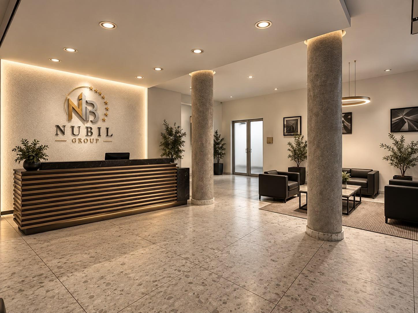 NUBIL GROUP logosunun yer aldığı resepsiyon ve ofis bekleme alanı